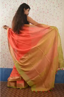 Orange Linen saree with blouse with zari border