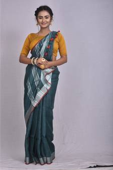 Bottle Green Linen saree with blouse with Zari Border