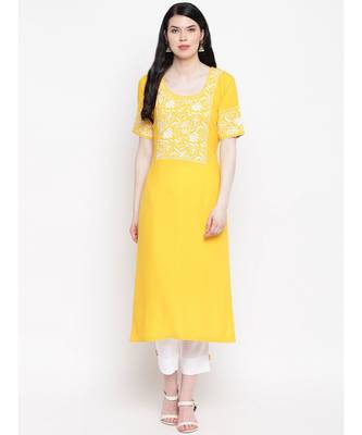 Yellow cotton rayon chikankari kurti with white cotton trousers 1