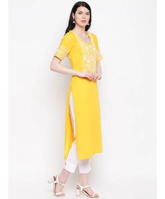 Yellow cotton rayon chikankari kurti with white cotton trousers 3