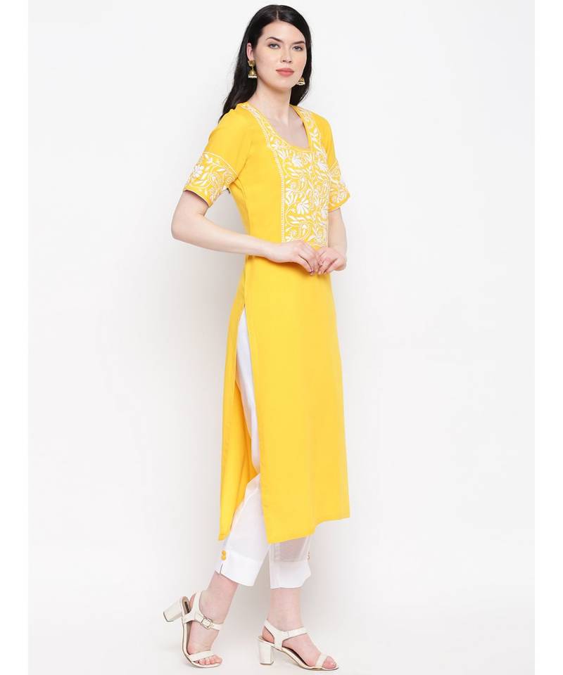 Yellow cotton rayon chikankari kurti with white cotton trousers