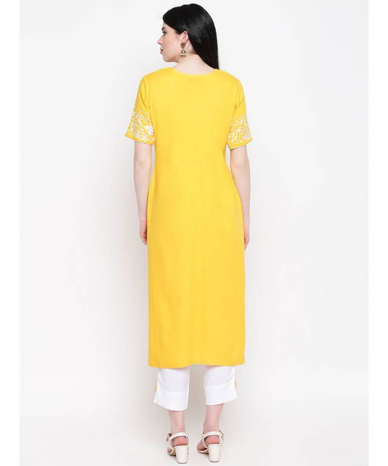 Yellow cotton rayon chikankari kurti with white cotton trousers