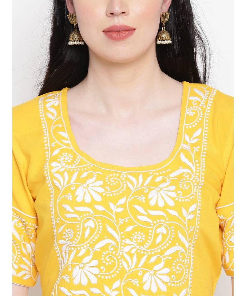 Yellow cotton rayon chikankari kurti with white cotton trousers