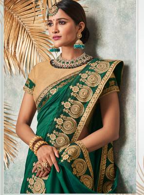 Dark green embroidered art silk saree with blouse 2