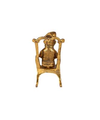 Lord Ganesha Statue Sitting on A Chair and Reading Ramayan 2