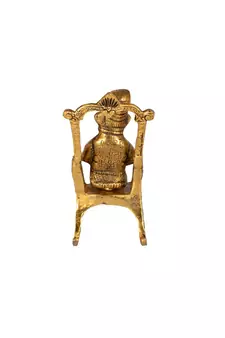 Lord Ganesha Statue Sitting on A Chair and Reading Ramayan