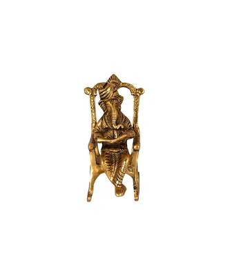 Lord Ganesha Statue Sitting on A Chair and Reading Ramayan 1
