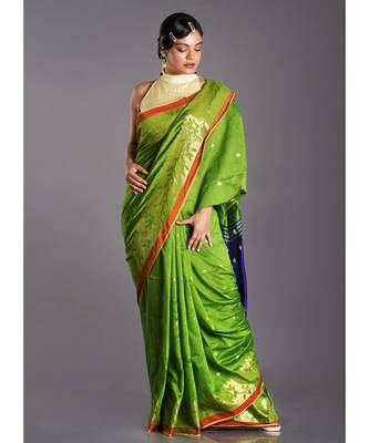 green blended cotton saree with blue pallu and golden motifs 1