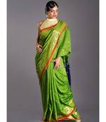 green blended cotton saree with blue pallu and golden motifs