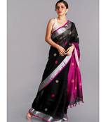 black linen saree with polka dots and pink pallu