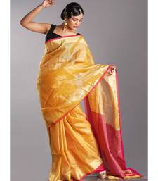 yellow tissue linen saree with pink pallu