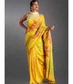yellow linen saree with red and green motifs