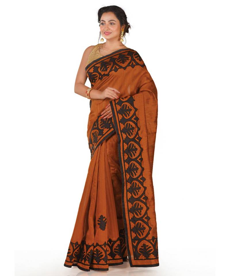 orange blended silk saree with black colour applque work