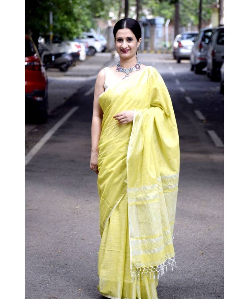 Khadi slub cotton in stunning lime yellow with silver threadwork on pallu & border