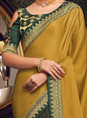 Yellow embroidered silk saree with blouse 4