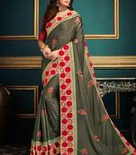 Green embroidered crepe saree with blouse