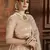 Beige embroidered net semi stitched lehenga