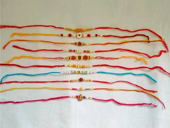 Assorted Ethnic Rakhi Set in Different Designs and Colors for Brother with a pack of Roli Chaval Set of 10 Rakhi 1