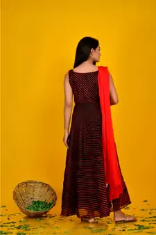 balck flared dress with red dupatta