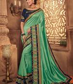 Green embroidered silk saree with blouse