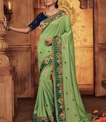 Green embroidered silk saree with blouse