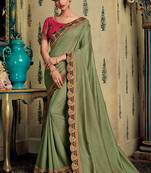 Green embroidered silk saree with blouse