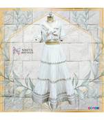 This gorgeous set of crop top and skirt has rose gold and off white coloured imported