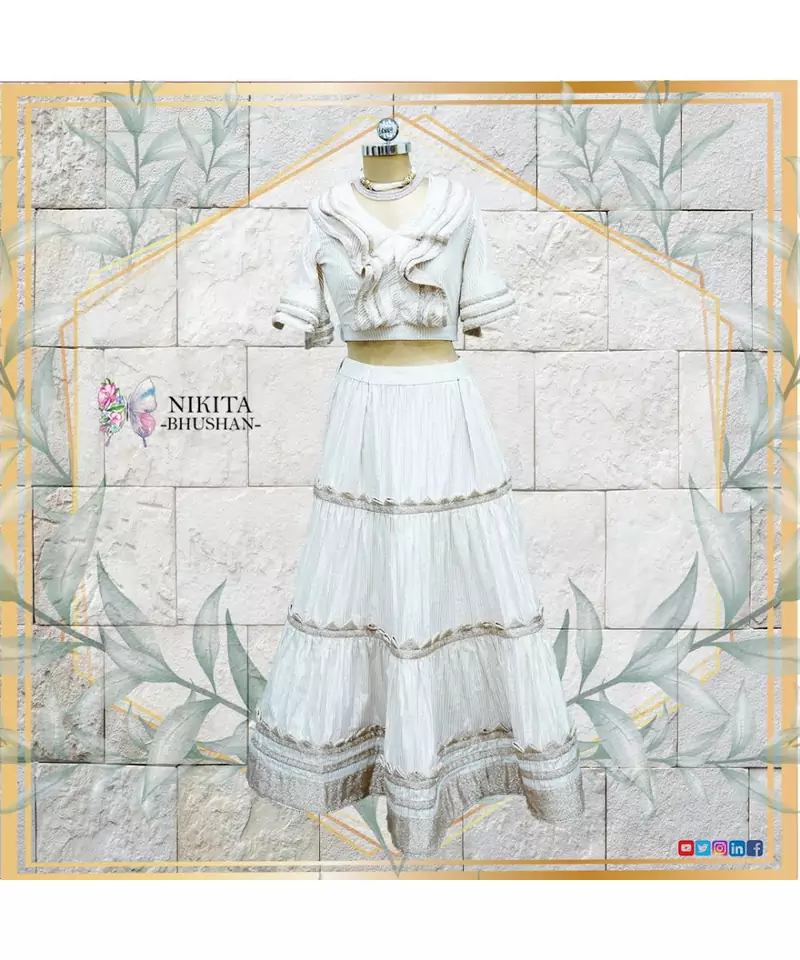This gorgeous set of crop top and skirt has rose gold and off white coloured imported