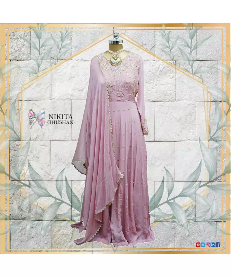 This beautiful dress made on chinon, is a anarkali with authentic and elegant hand embroidery done all over the dress