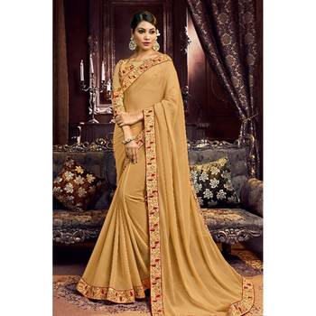 Dark chiku embroidered georgette saree with blouse 1