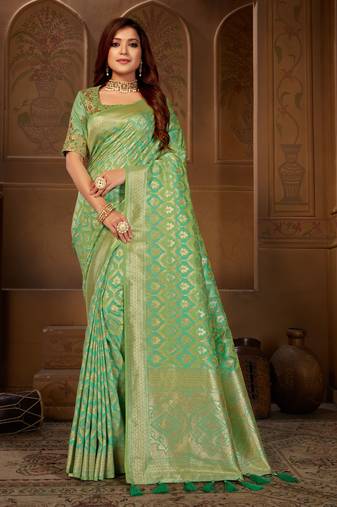 Green woven silk blend saree with blouse