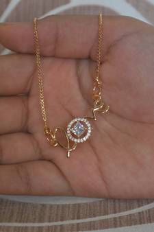 White stone studded Love pendent with chain