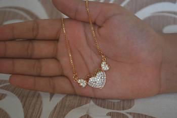 Heart shape white stone studded pendent with chain 1