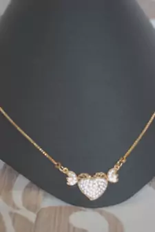 Heart shape white stone studded pendent with chain