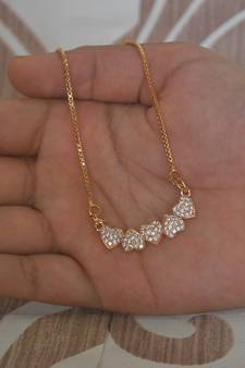 Heart shape white stone studded pendent with chain