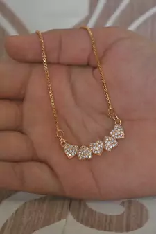 Heart shape white stone studded pendent with chain