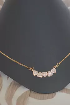 Heart shape white stone studded pendent with chain
