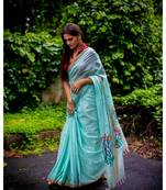 Amplify your style in this classic khadi cotton jamdani saree with multicolor floral motifs