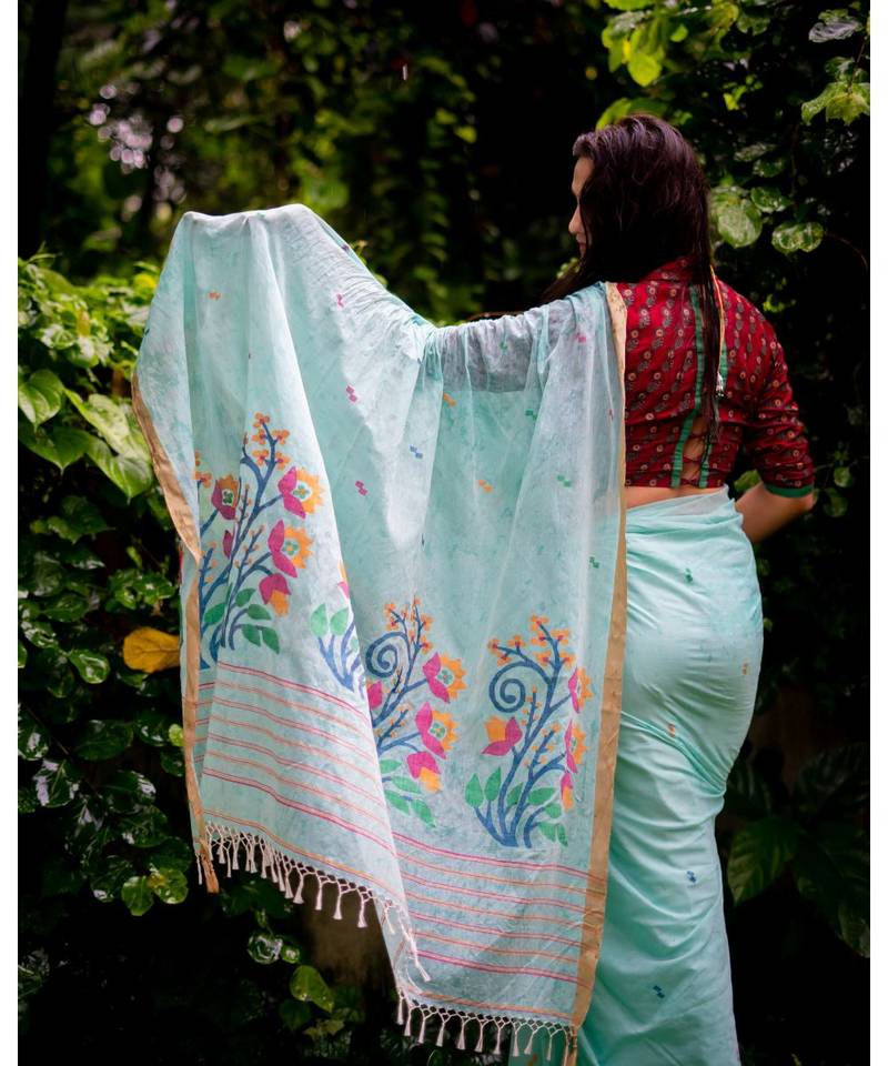 Amplify your style in this classic khadi cotton jamdani saree with multicolor floral motifs