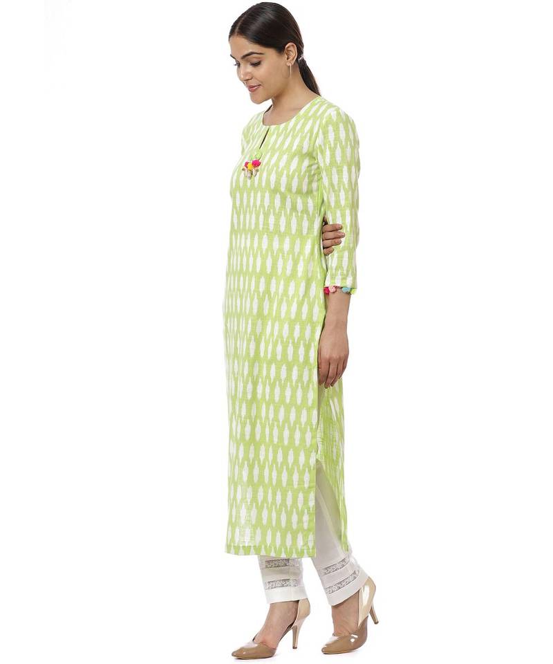 Green Ikkat Kurti with Off-White Crochet Pants