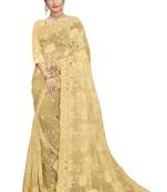 Cream embroidered net saree with blouse