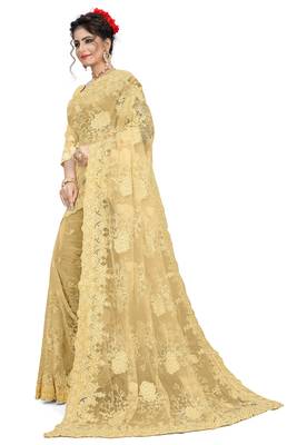 Cream embroidered net saree with blouse 2