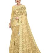 Cream embroidered net saree with blouse