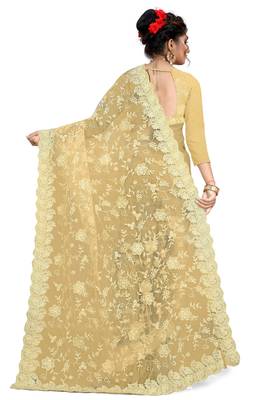 Cream embroidered net saree with blouse 3
