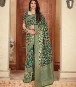 Green woven banarasi silk saree with blouse