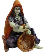 Lady in purple dress Making Tokri