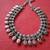 Oxidized neck piece