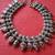 Oxidized neck piece