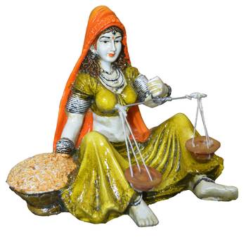 Rajasthani lady with Taraju 1
