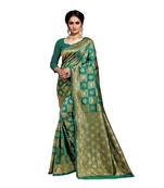 Dark green woven banarasi silk saree with blouse
